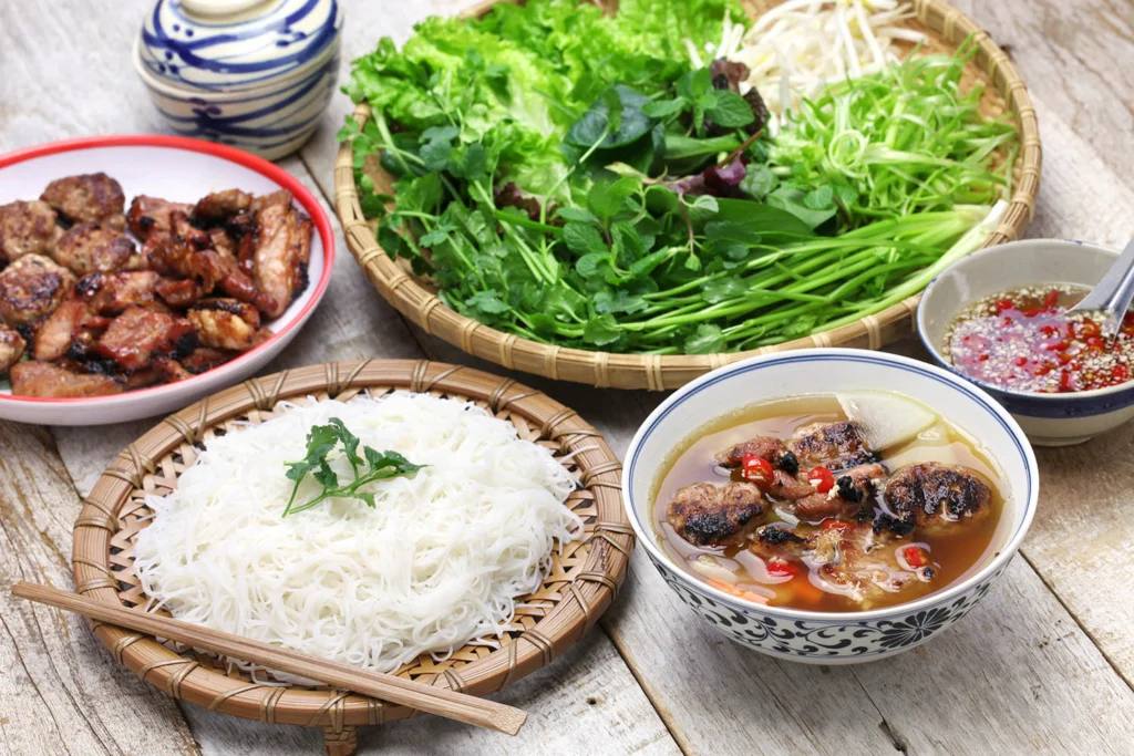 Hanoi bun cha with grilled pork, noodles, herbs and dipping sauce