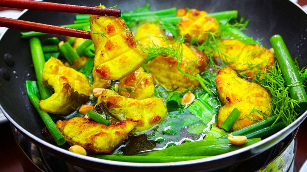 Hanoi cha ca fish with dill and spring onion